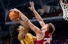 Jaden Henley (24) of the Minnesota Gophers is defended by Race Thompson (25) of the Indiana Hoosiers in the first half Wednesday, Jan. 25, 2023, at Wi