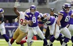 Vikings quarterback Kirk Cousins was sacked by the 49ers' DeForest Buckner in the first quarter.