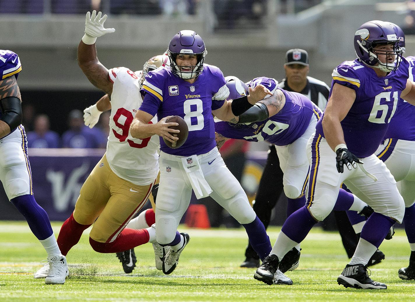 Vikings quarterback Kirk Cousins was sacked by the 49ers' DeForest Buckner in the first quarter.