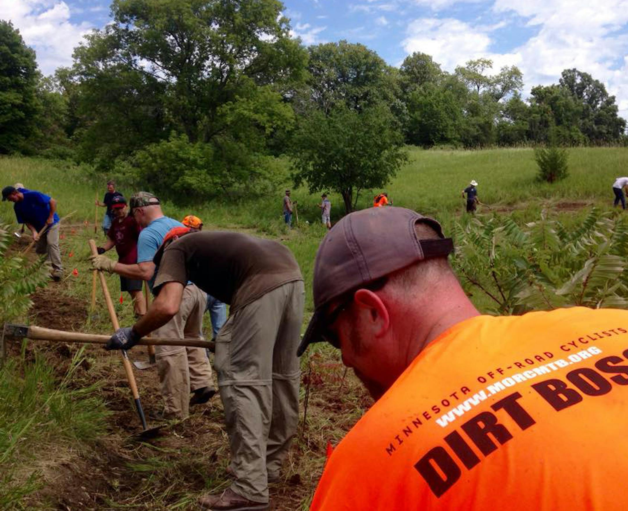 MORC members worked on trails at Lake Rebecca last summer. MORC treasurer and "dirt boss" Graydon Betts is shown in the foreground. ORG XMIT: 3DPK1hN7s4ORdMvdizaB