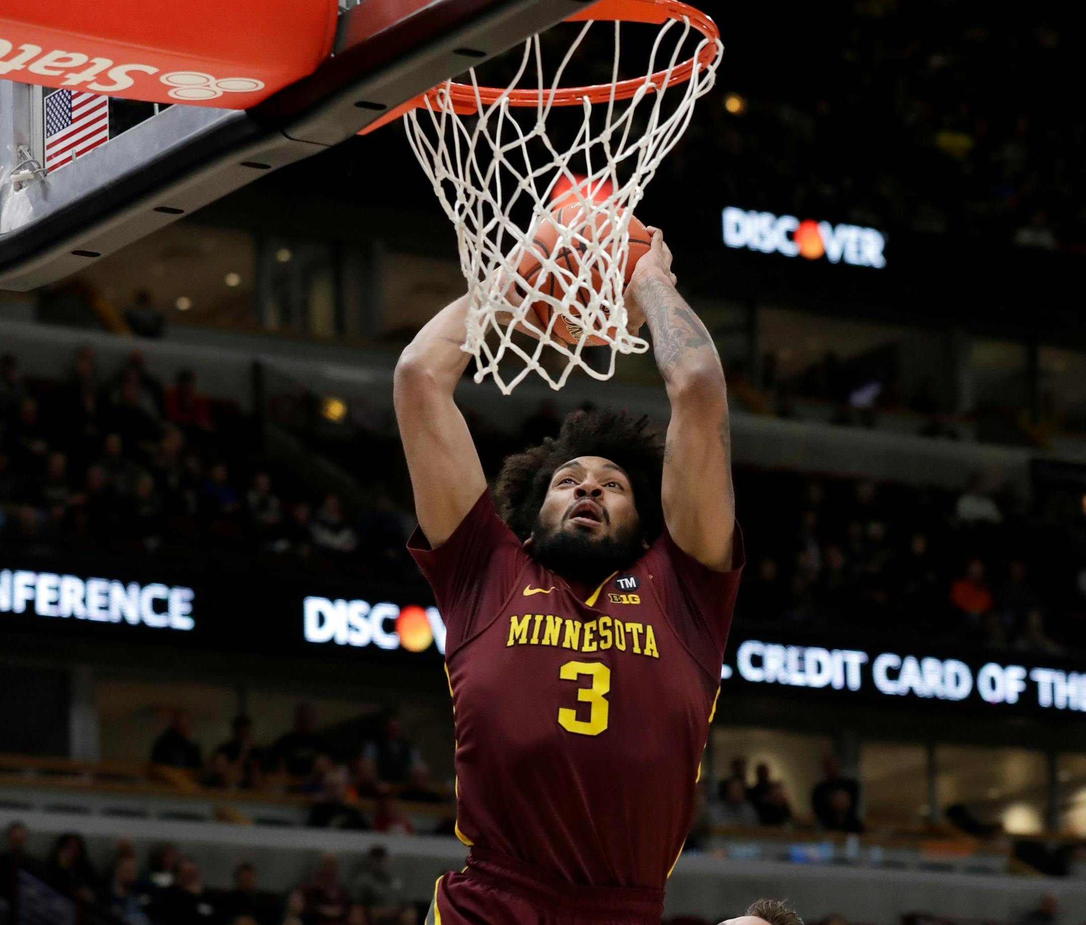 Jordan Murphy goes up for a dunk against Purdue's Grady Eifert