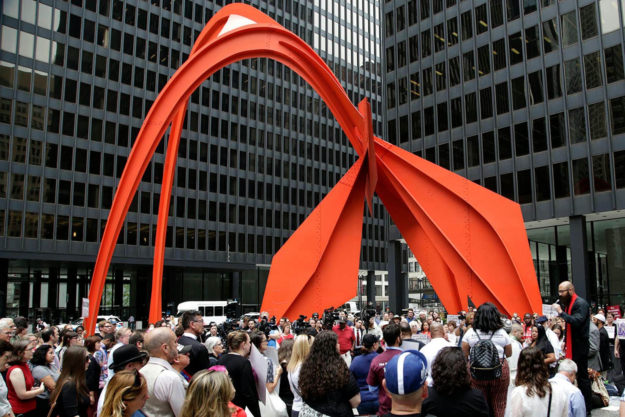 Pastor Tom Gaulke speaks at an interfaith service to show solidarity with the people of Charlottesville, Va., Monday, Aug. 14, 2017, in Chicago. Those in attendance decried hatred and racism after a white supremacist rally in Virginia that spiraled into violence on Saturday.