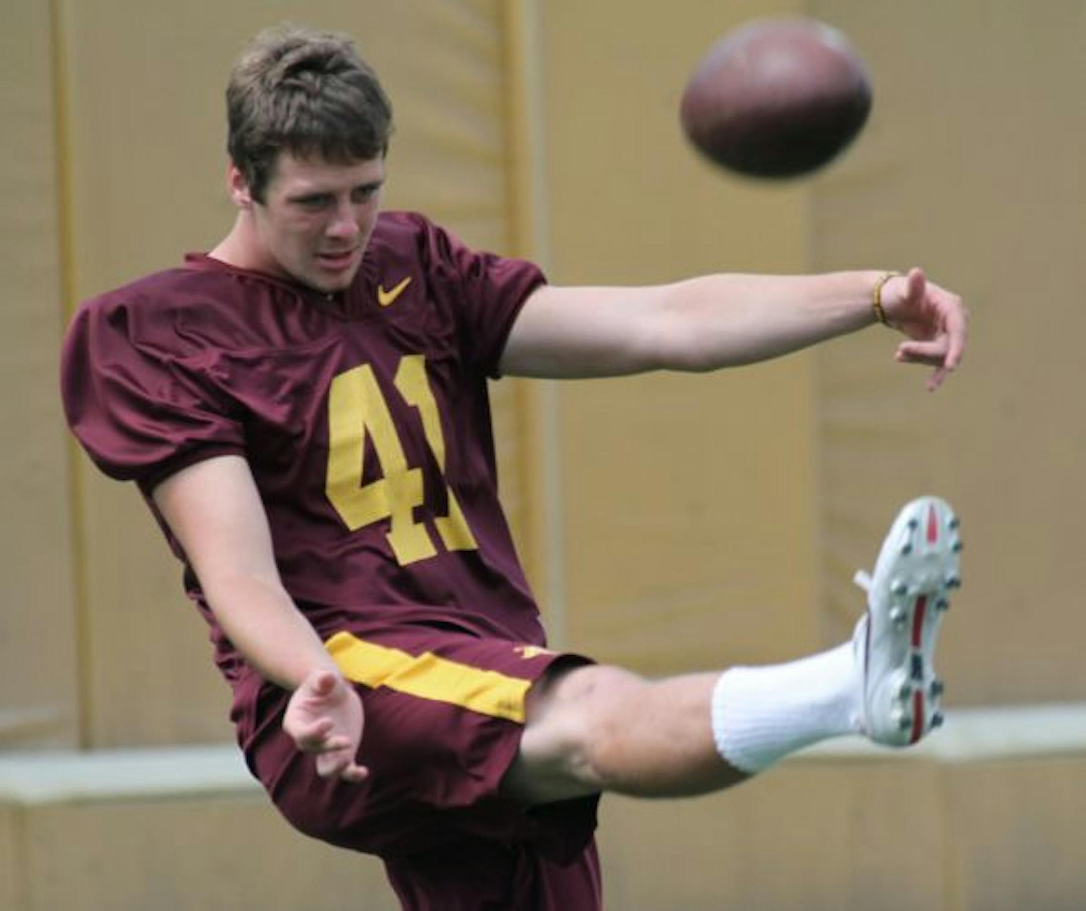 Dan Orseske kicked the ball during football practice.
