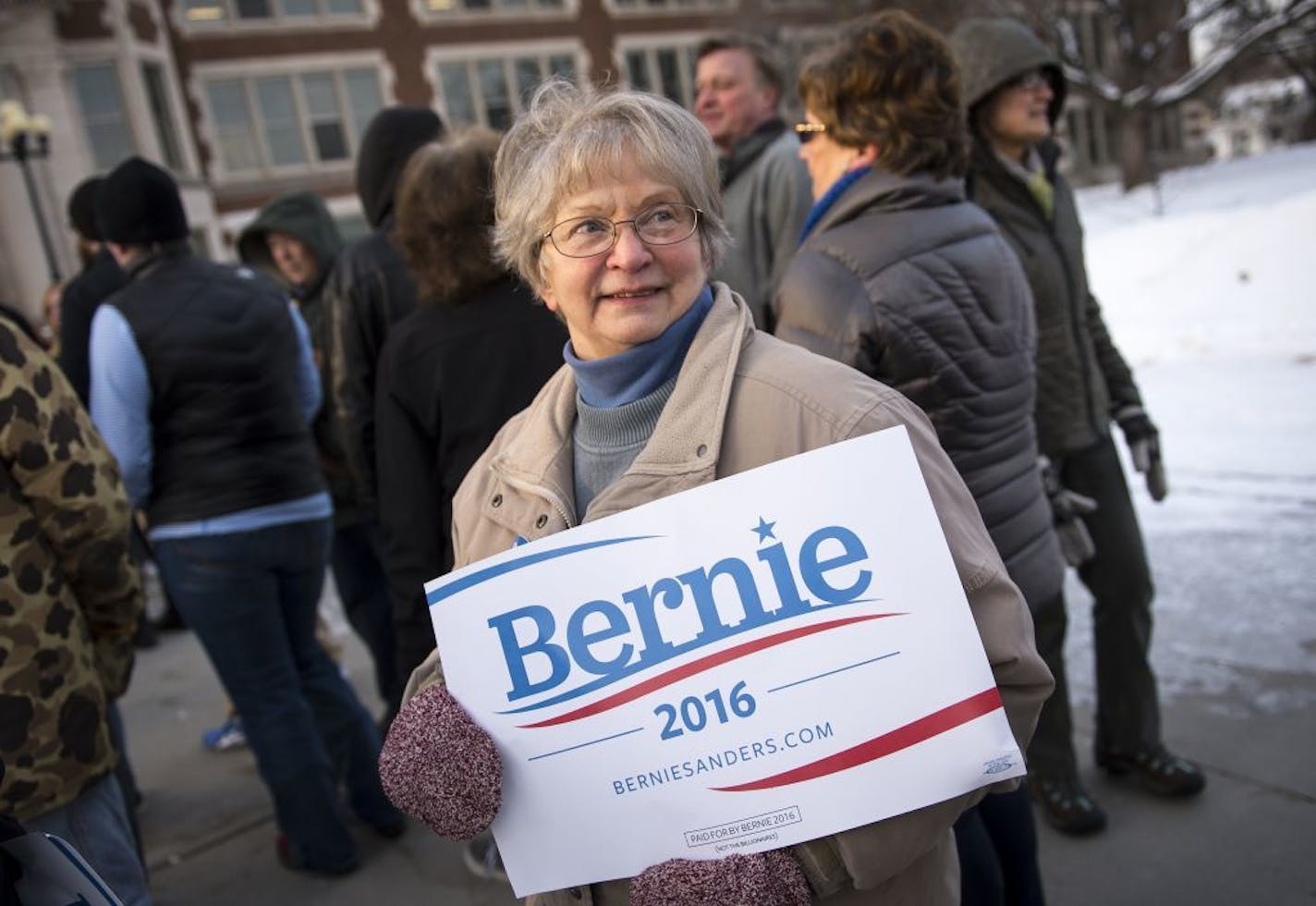 Vicki Andrews, 71, of Grand Rapids, waited to hear Bernie Sanders speak outside of Hibbing High School on Friday morning .