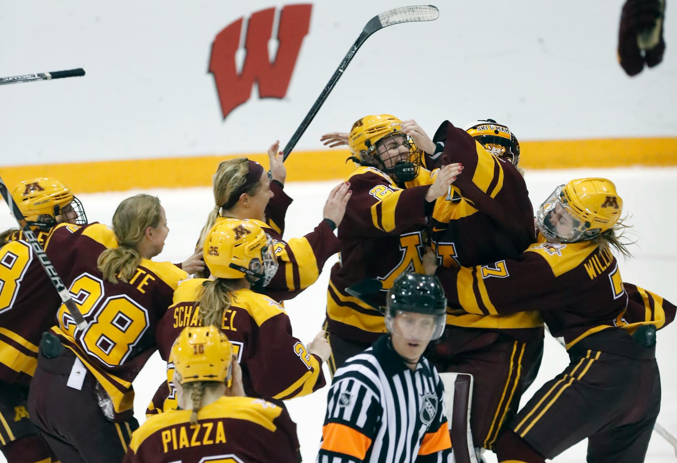 Gophers rush goalie Sidney Peters(37) after they clinch the title .]Gophers play the Badgers for the women's hockey WCHA Final Faceoff Championship at Ridder Arena.Richard Tsong-Taatarii•rtsong-taatarii@startribune.com