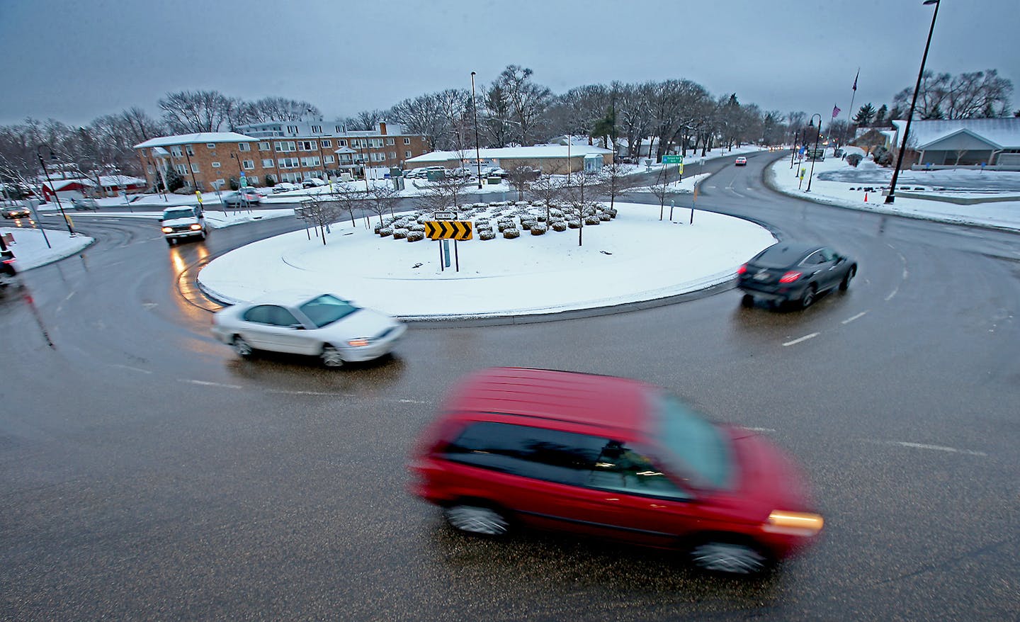 Drivers made their way around the roundabout at 66th & Portland, Wednesday, January 21, 2015 in Richfield, MN. Minnesota drivers can expect to see more roundabouts in the coming years, and not just in the metro area. According to numerous studies, replacing a traffic signal with a roundabout can cut serious accidents by 80 percent, while handling a greater number of vehicles and reducing air pollution. ] (ELIZABETH FLORES/STAR TRIBUNE) ELIZABETH FLORES &#x2022; eflores@startribune.com