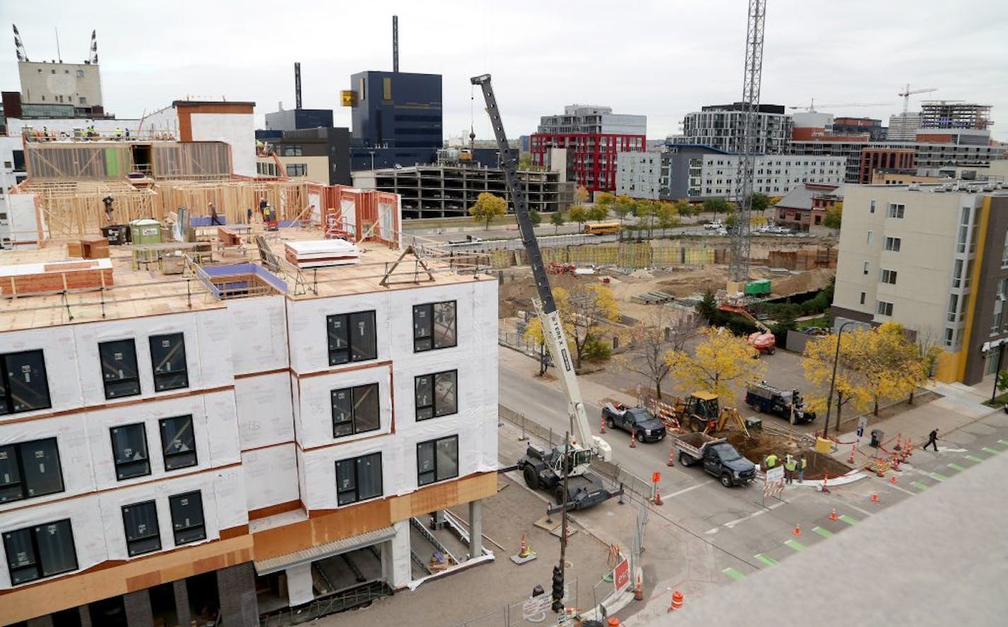 Twin Cities apartment owners are partnering on a unique 30-acre solar garden that's expected to generate enough electricity to power nearly 4,000 apartments in Minneapolis. Here, construction is seen on one of the apartment complexes under construction for the project Wednesday, Oct. 11, 2017, in Minneapolis, MN.