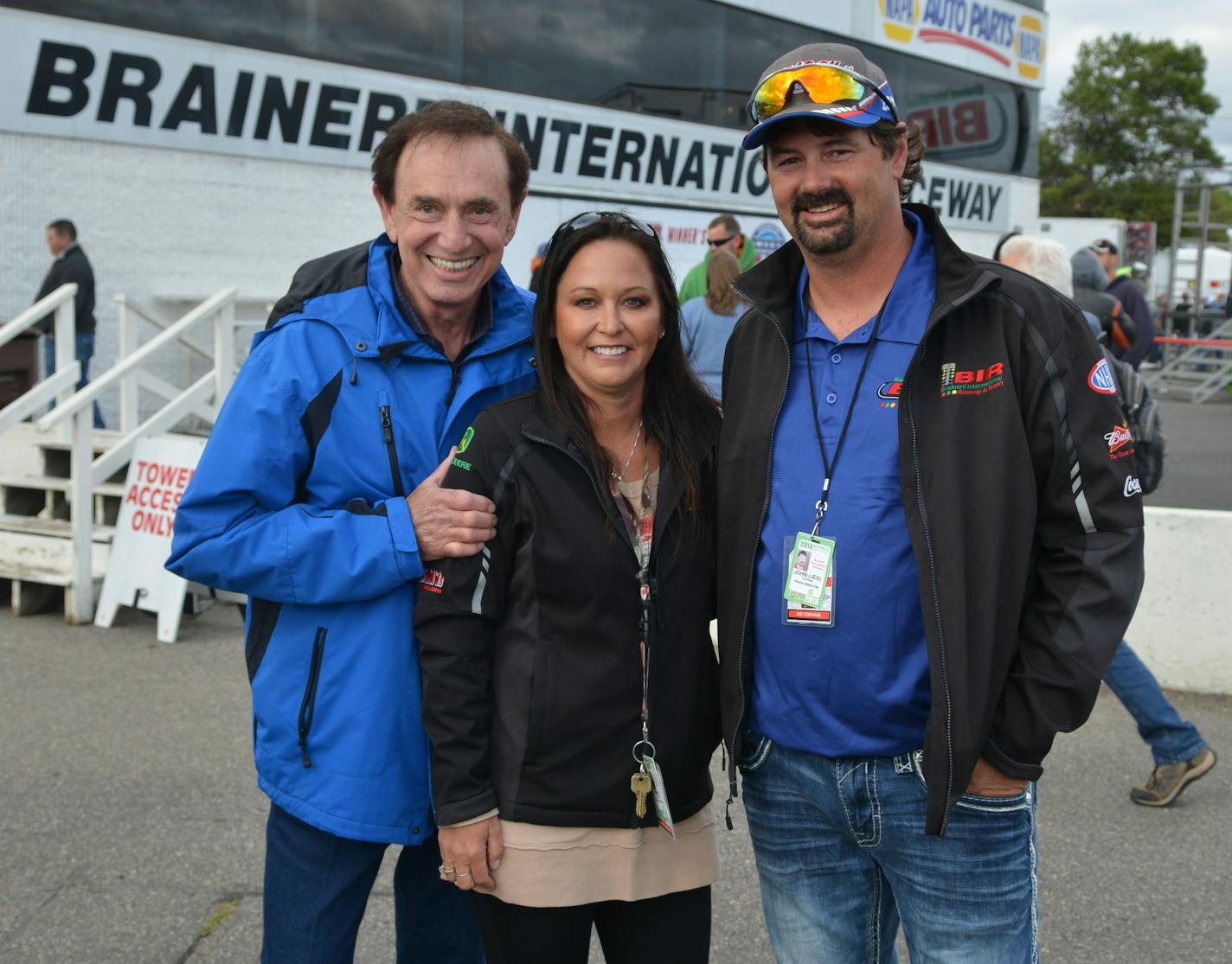 Jed Copham, right, owner of Brainerd International Raceway (BIR), died while boating with his family in Florida. He is shown here at BIR with his wife Kristi, and Forrest Lucas, founder and owner of Lucas Oil Products.