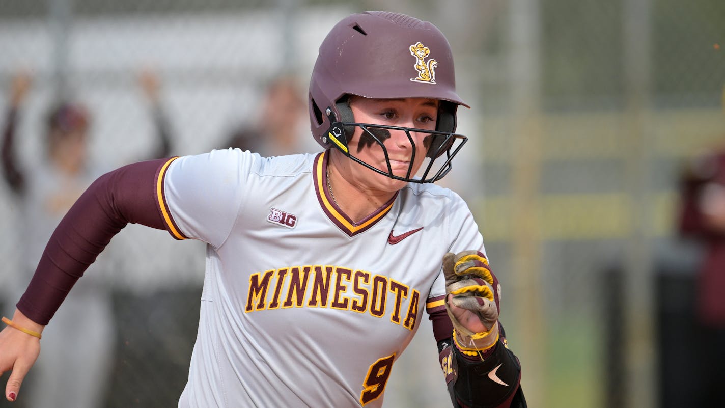 Minnesota's Jess Oakland (9) runs after hitting a pitch during an NCAA college softball game against Western Kentucky, Sunday, Feb. 12, 2023, in Leesburg, Fla. (AP Photo/Phelan M. Ebenhack)