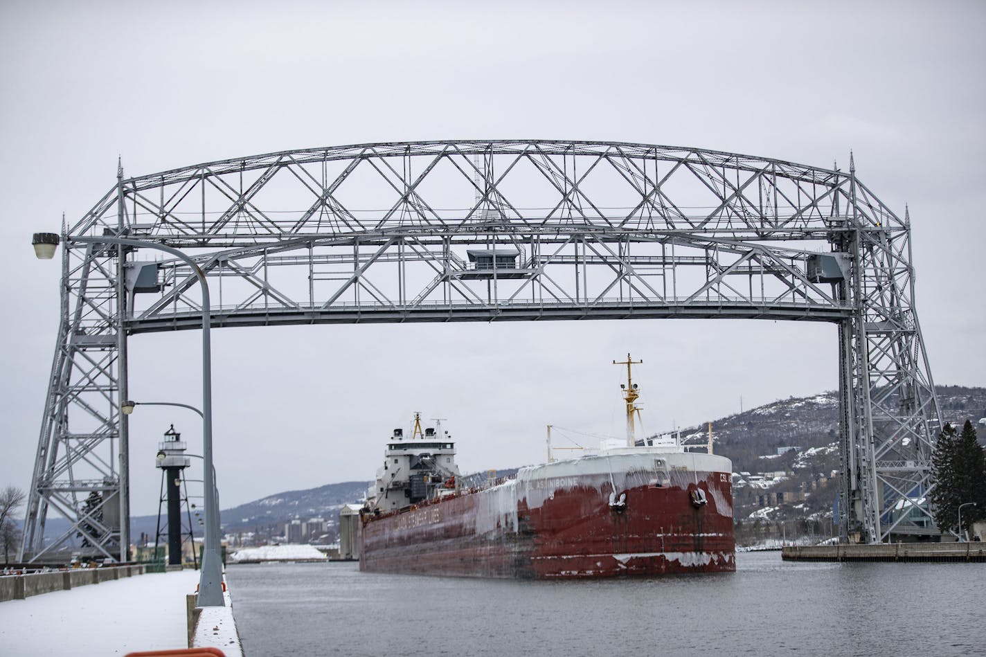 The USL Assiniboine pulled into the Duluth Harbor, exiting under the aerial lift bridge on November 13, 2019. ]
ALEX KORMANN &#x2022; alex.kormann@startribune.com The USL Assiniboine pulled out of the Duluth Harbor, exiting, under the aerial lift bridge on November 13, 2019.