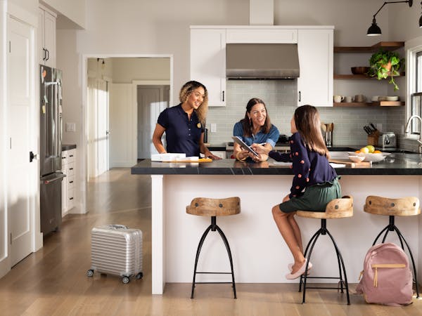 Enjoy Technology sends knowledgeable sales representatives, depicted in this company-provided image by the woman on the left, to meet with consumers i