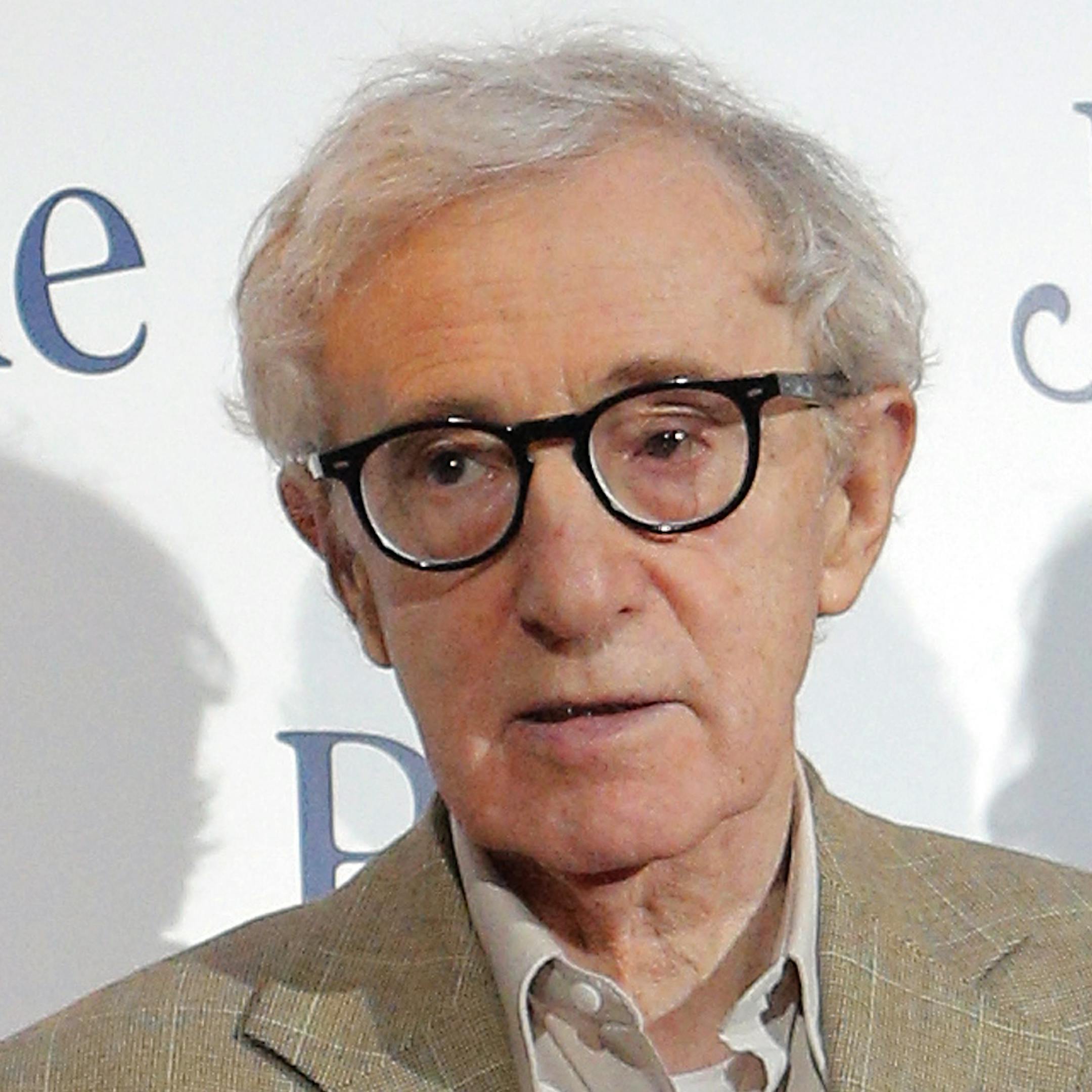 Director and actor Woody Allen, poses as he arrives for the French premiere of Blue Jasmine, in Paris, Tuesday, Aug. 27, 2013. (AP Photo/Christophe Ena) ORG XMIT: MIN2013091500115372