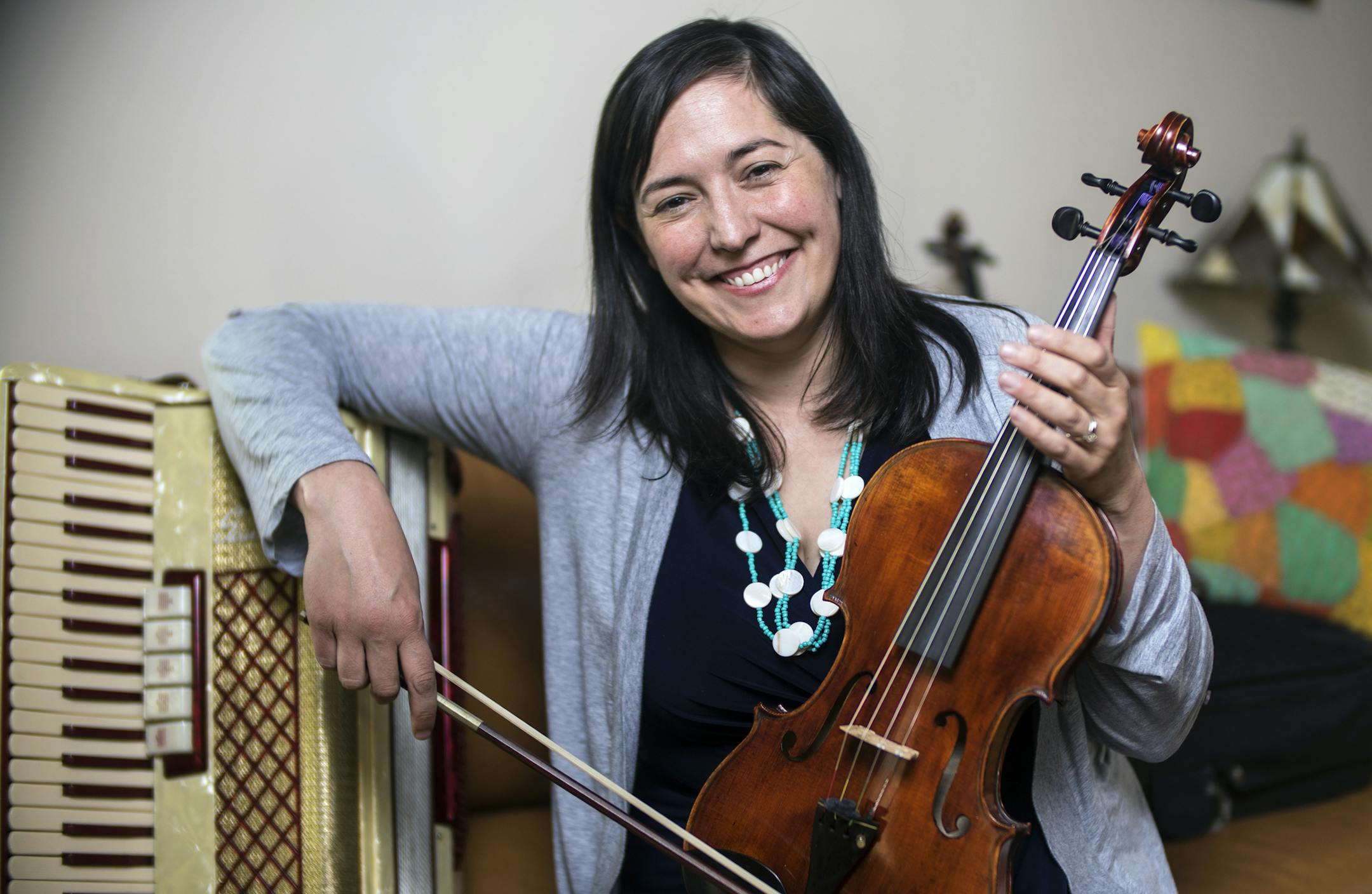 Caitlin Marlotte, executive director of Vega Productions, helps facilitate instrument donations, including this accordion and viola, to schools across Minnesota to keep music and art education programs going.] Richard Tsong-Taatarii/rtsong-taatarii@startribune.com