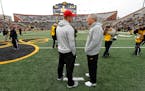 Nebraska head coach Scott Frost, left, talks with Iowa head coach Kirk Ferentz before an NCAA college football game, Friday, Nov. 23, 2018, in Iowa Ci