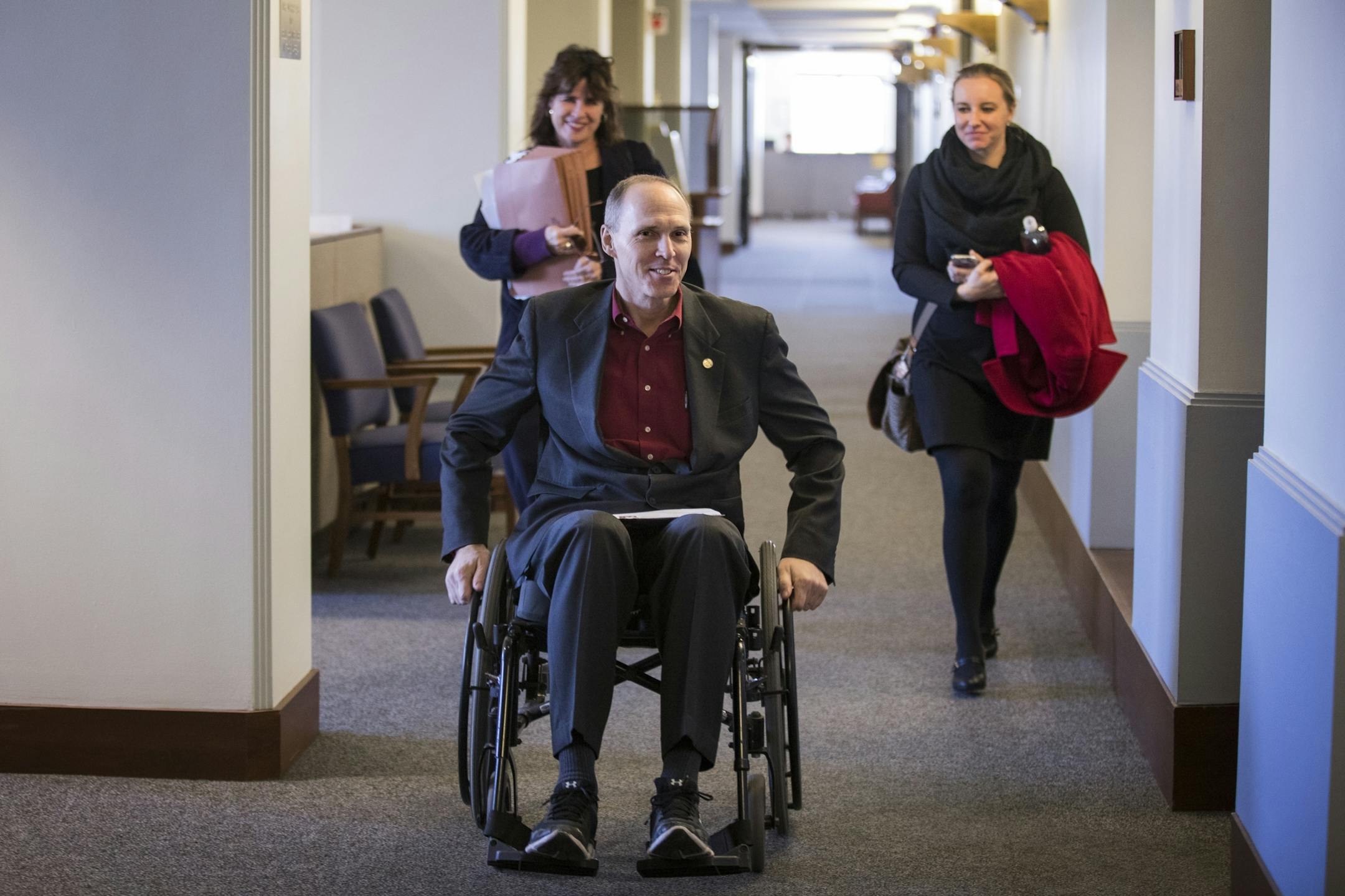 Rep. Rod Hamilton goes back to his office for a meeting with Nancy Silesky of the Minnesota Inter-County Association, left, and Rochelle Westlund of the Association of Minnesota Counties.