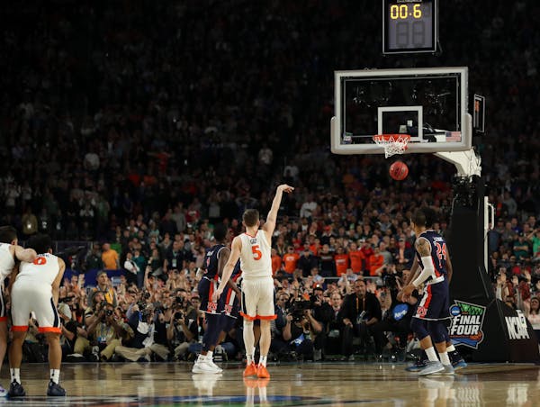 Virginia guard Kyle Guy made the final of three free throws to win Saturday's semifinal over Auburn.