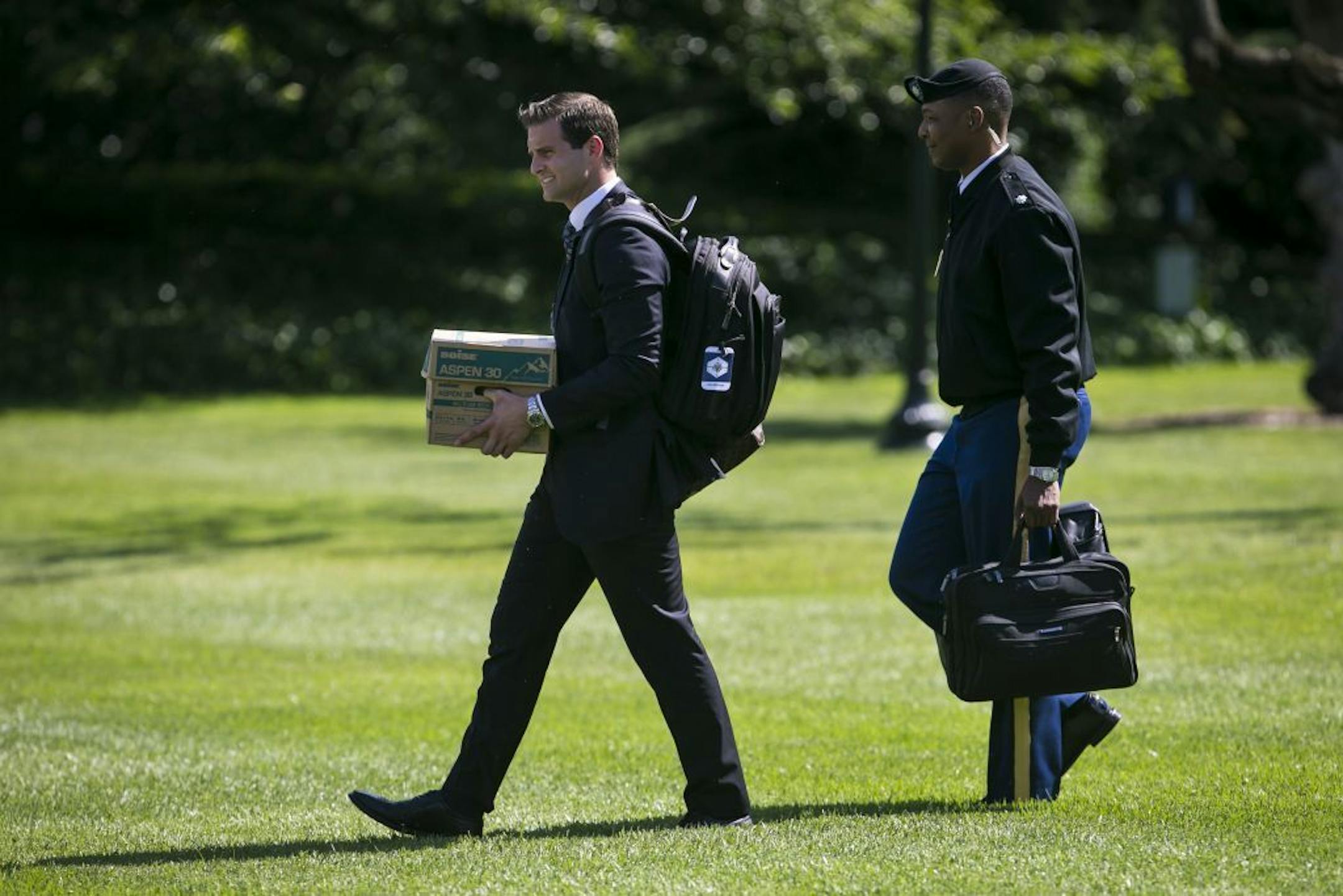 John McEntee, President Donald Trump's personal aide, walked to Marine One on the South Lawn of the White House in Washington, June 9, 2017. McEntee, who has served as President Trump's personal assistant since Trump won the presidency, was forced out of his position and escorted from the White House on March 12, 2018, after his security clearance was revoked, officials with knowledge of the incident said.