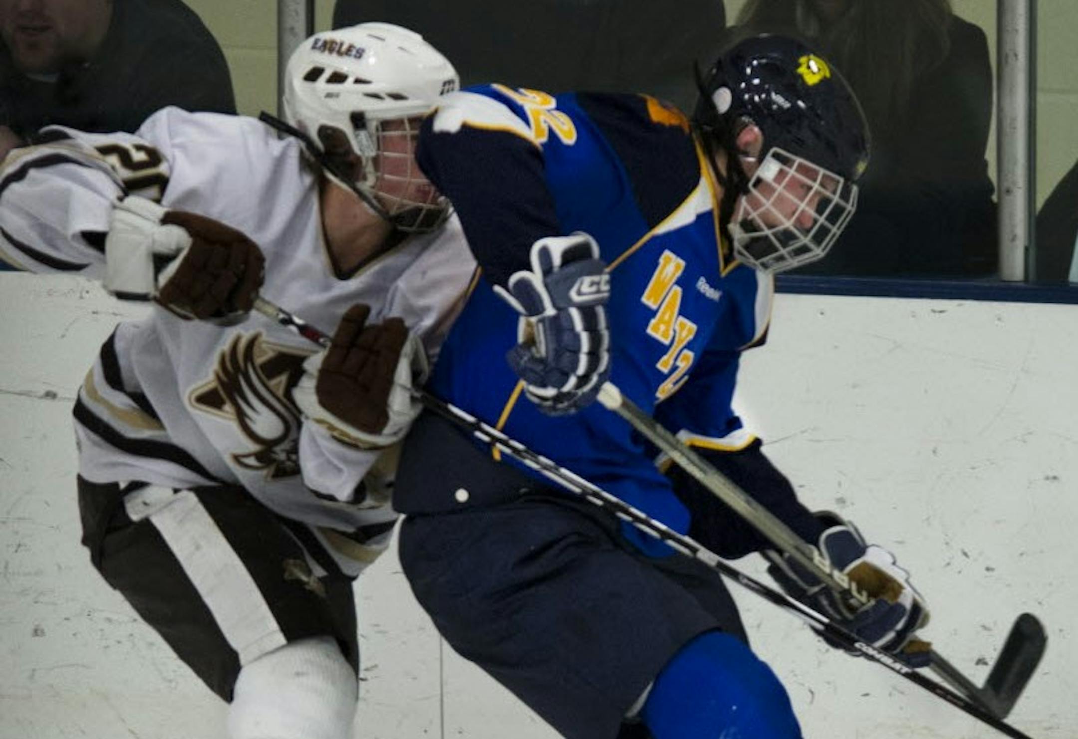 Mario Lucia, right, when he skated for Wayzata High School.