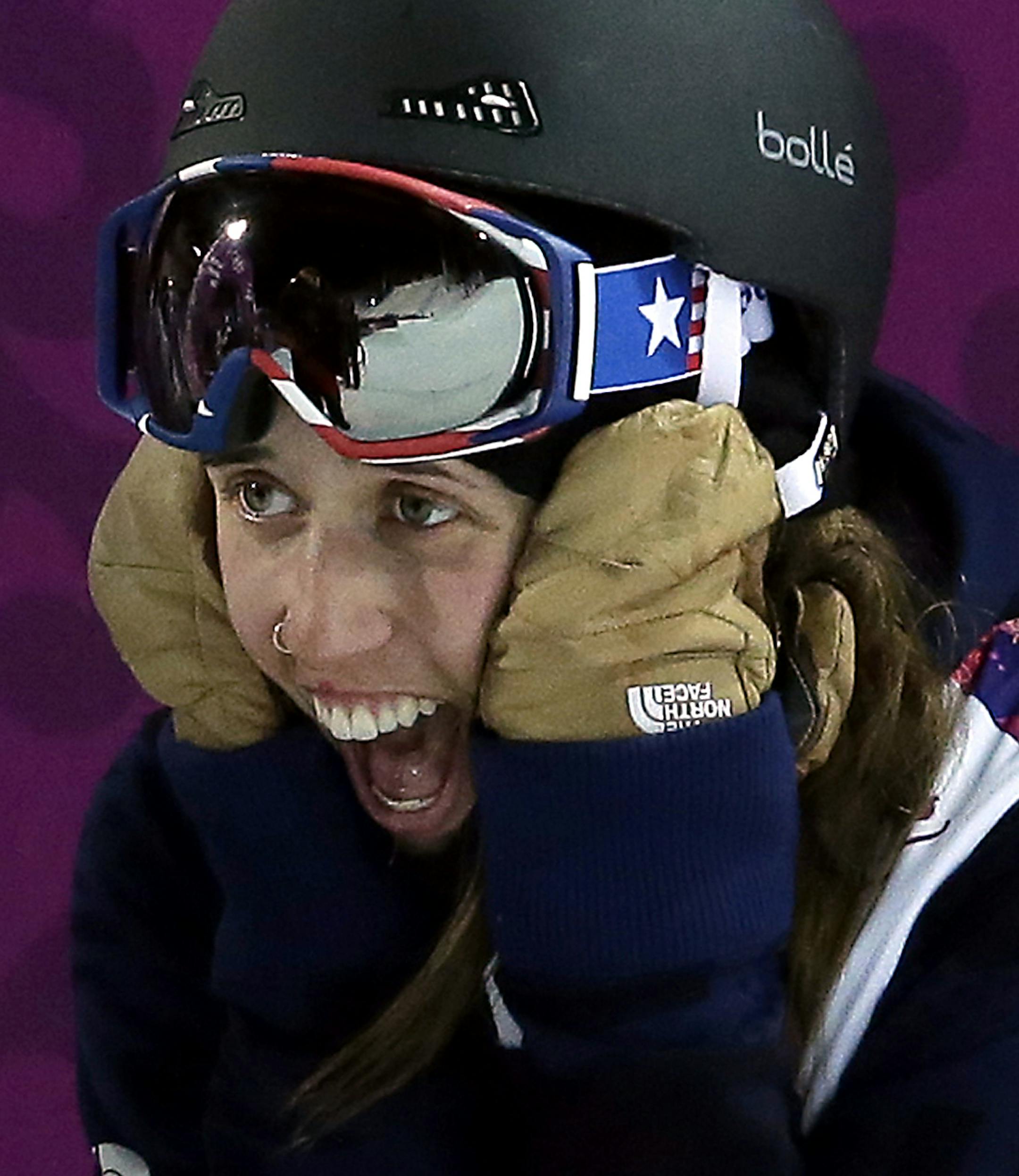 Gold medalist Maddie Bowman of the United States reacts after learning her score in the women's ski halfpipe at the Rosa Khutor Extreme Park, at the 2014 Winter Olympics, Thursday, Feb. 20, 2014, in Krasnaya Polyana, Russia. (AP Photo/Charlie Riedel)