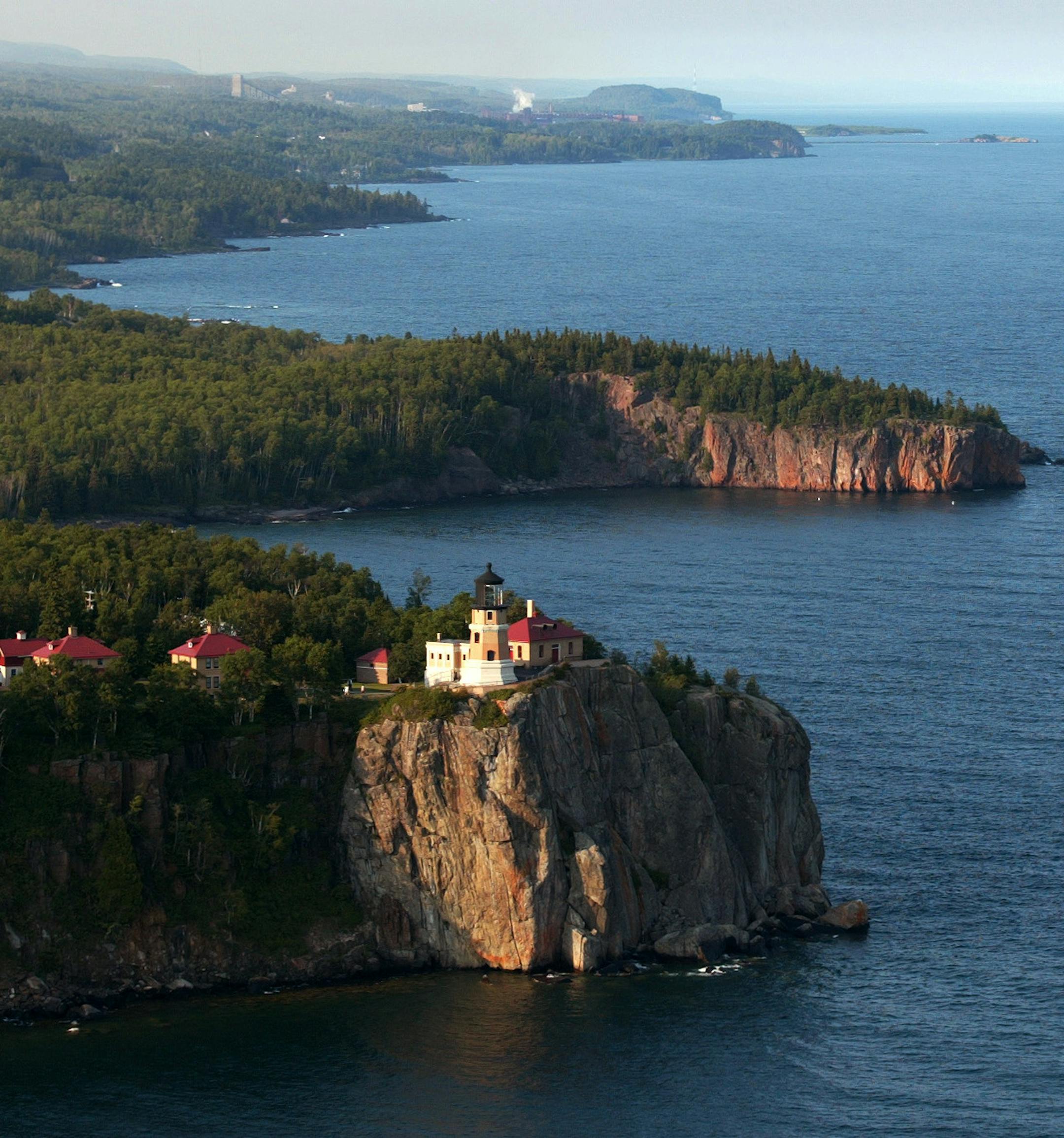 Lake Superior, North Shore Minnesota - 7/18/2002 A dozen of the worlds largest lakes, including Lake Superior, are ecological "Canaries in the mine" that could provide vital cluse to the health of the environment. Last week a group of 20 scientists gathered in Duluth last weekend and plan to ask the National Science Foundation to devote at least $5 million to the study of the large lakes in the next three years. Here, Split Rock Lighthouse, is perched on the rocky north shore of Lake Superior Th