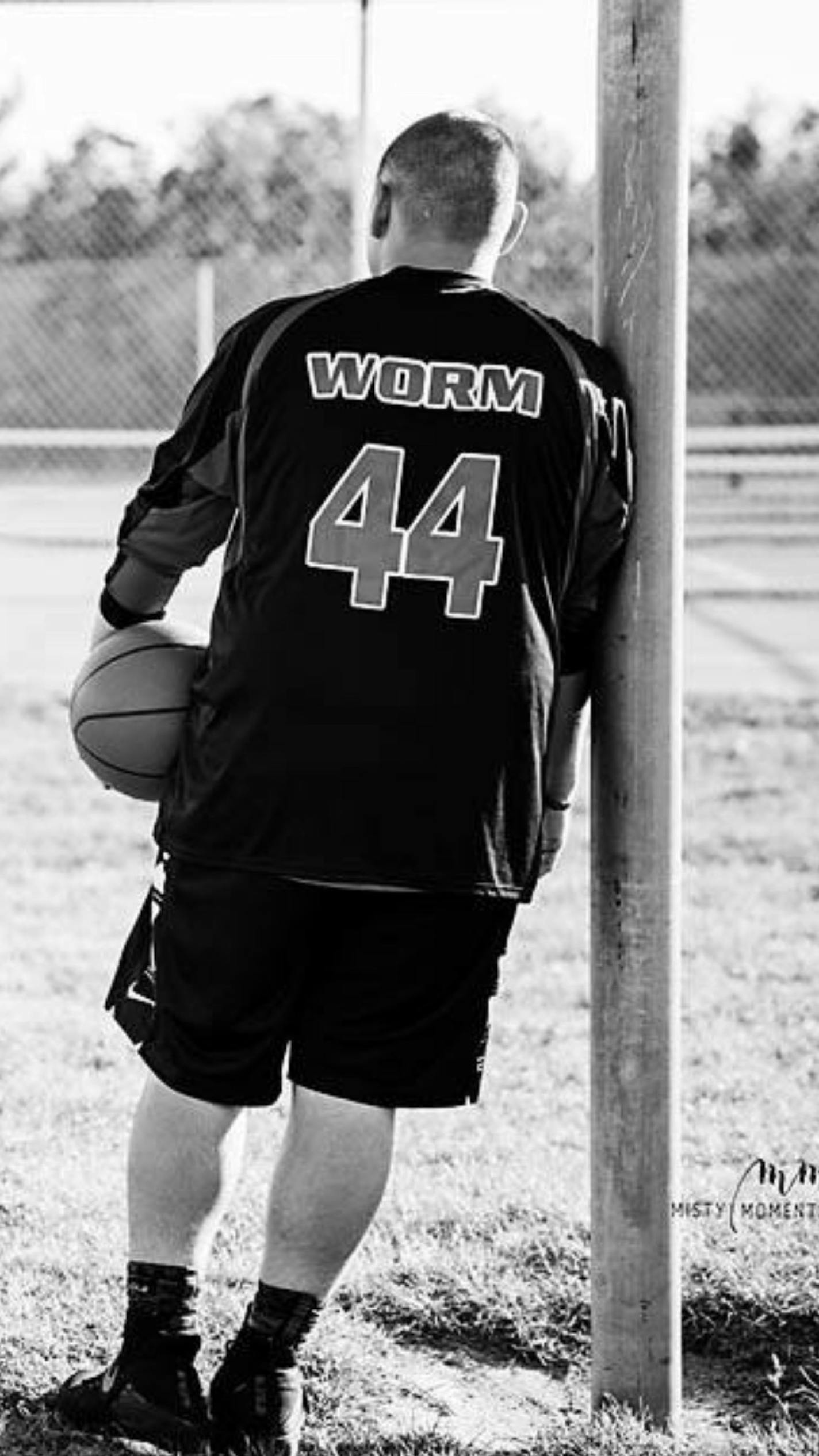 Members of the Cass Lake-Bena basketball team wear warmups honoring their missing teammate Jeremy "Big Worm" Jourdain. (Photo credit Misty Moments Photography)