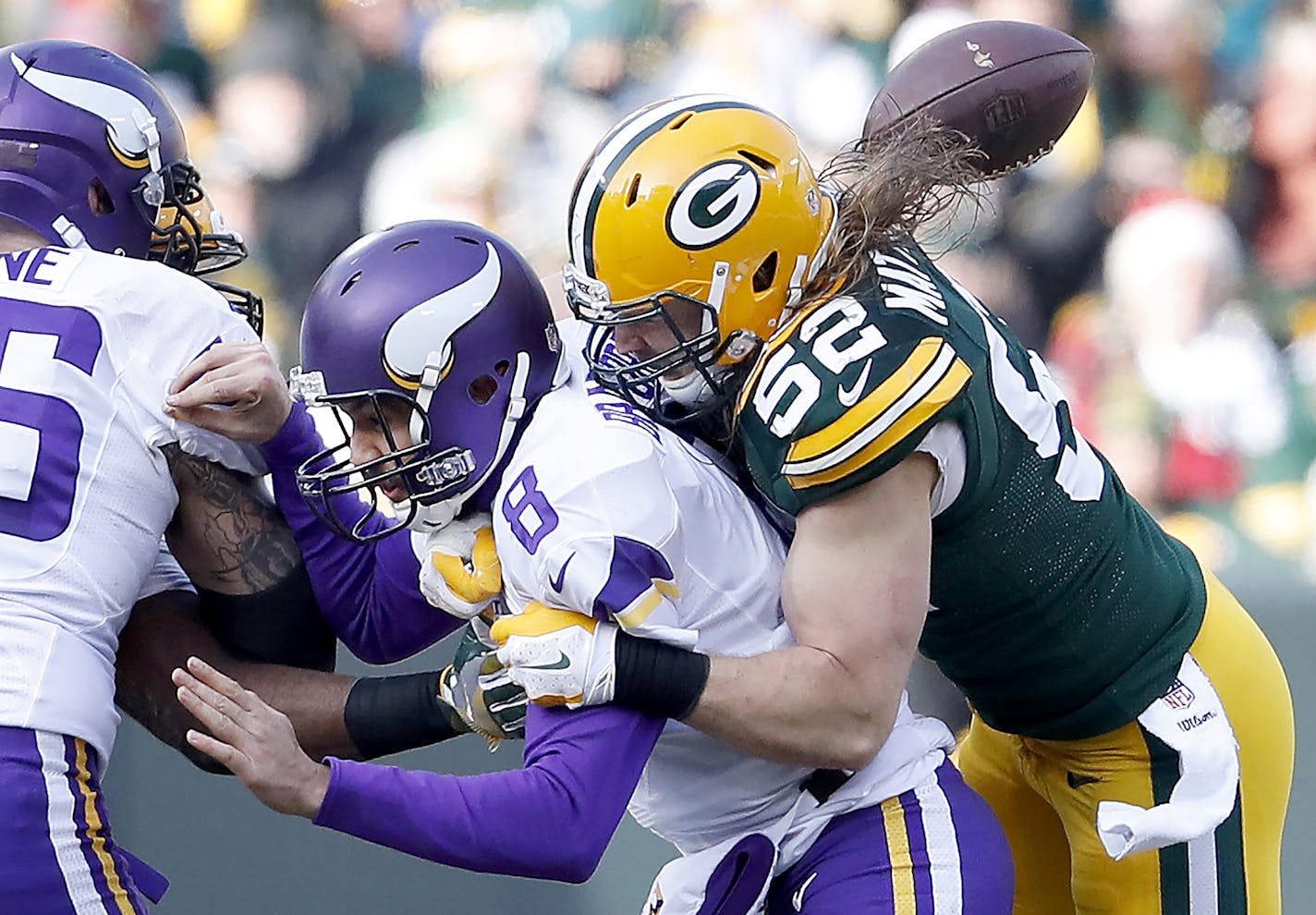 Vikings quarterback Sam Bradford (8) fumbled the ball as he was sacked by Clay Matthews (52) in the second quarter. ] CARLOS GONZALEZ cgonzalez@startribune.com - December 24, 2016, Green Bay, WI, Lambeau Field, NFL, Minnesota Vikings vs. Green Bay Packers