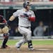 Minnesota Twins' Robbie Grossman watches his two-run single off Cleveland Indians relief pitcher Cody Allen during the seventh inning of a baseball ga