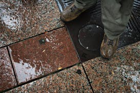Rain fell on granite pavers on Nicollet Mall in downtown Minneapolis in 2010.