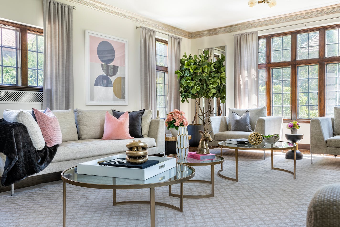 Pastel pink and round furniture elements fill this elegant living space. (Provided photo/TNS)