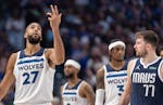 Rudy Gobert of the Timberwolves gestures while Luka Doncic looks on during Game 3 of the Western Conference finals in Dallas.