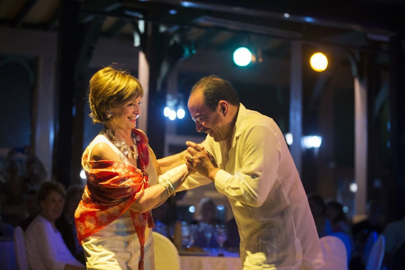 Marilyn Nelson dances with Minnesota Orchestra trumpet player Manny Laureano during dinner at the Hotel Nacional in Havana, Cuba on Wednesday, May 13, 2015.