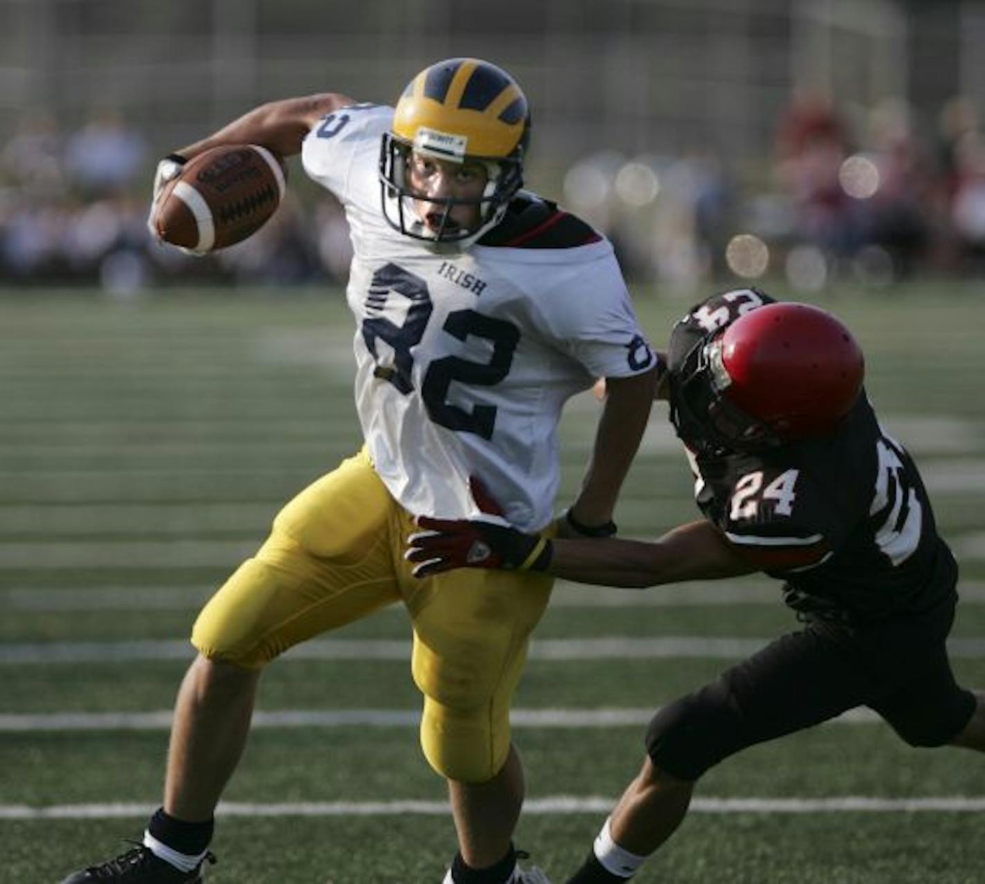 Rosemount's Zachary Vraa (82) gained some yards against Eden Prairie's Jordan Price (24) during the first half.