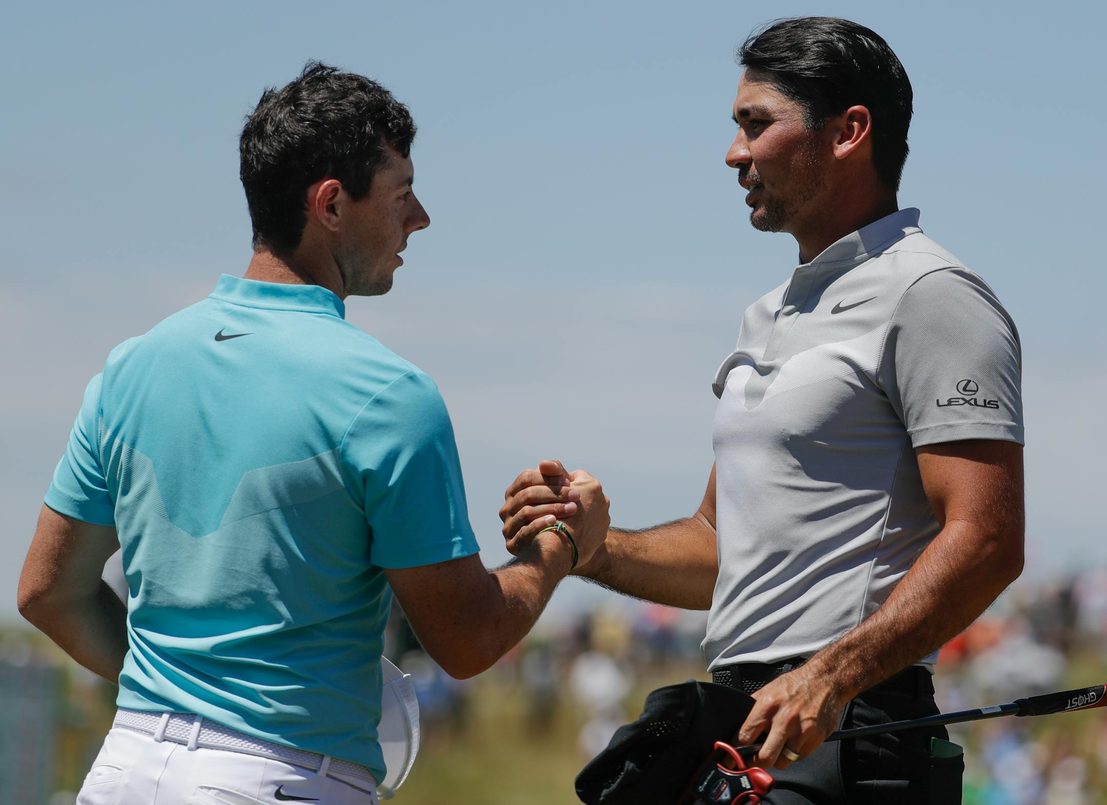 Jason Day, of Australia, and Rory McIlroy, of Ireland, shake hands after the second round of the U.S. Open golf tournament Friday, June 16, 2017, at Erin Hills in Erin, Wis. (AP Photo/Chris Carlson)