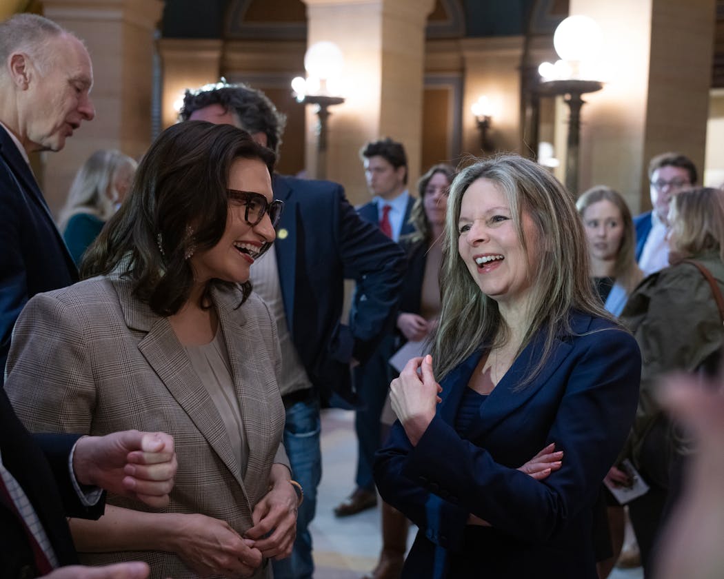 Lt. Gov. Peggy Flanagan, left, congratulates Justice Sarah Hennesy on her appointment to the Minnesota Supreme Court on Monday at the State Capitol in St. Paul.