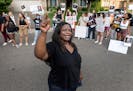 Nekima Levy Armstrong and protesters outside of the home of Ramona Dohman, the United States Marshal for the District of Minnesota.