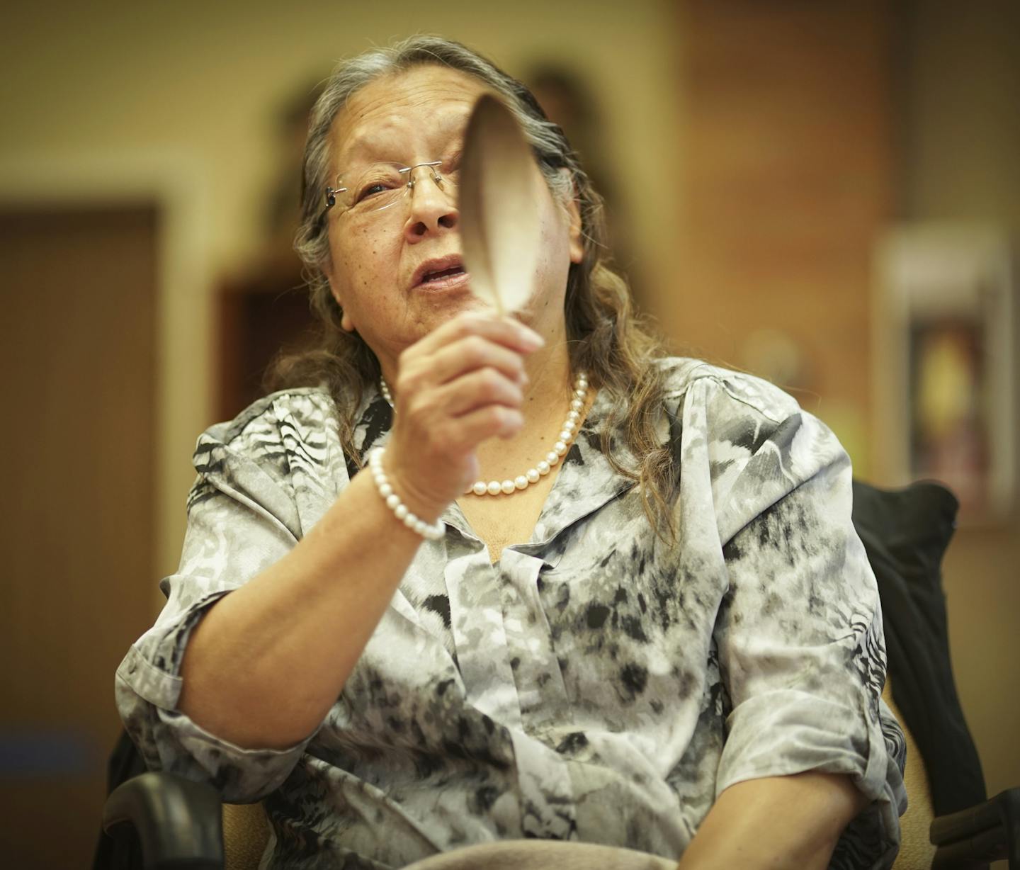 Nelda Goodman held an eagle feather as part of a talking circle.