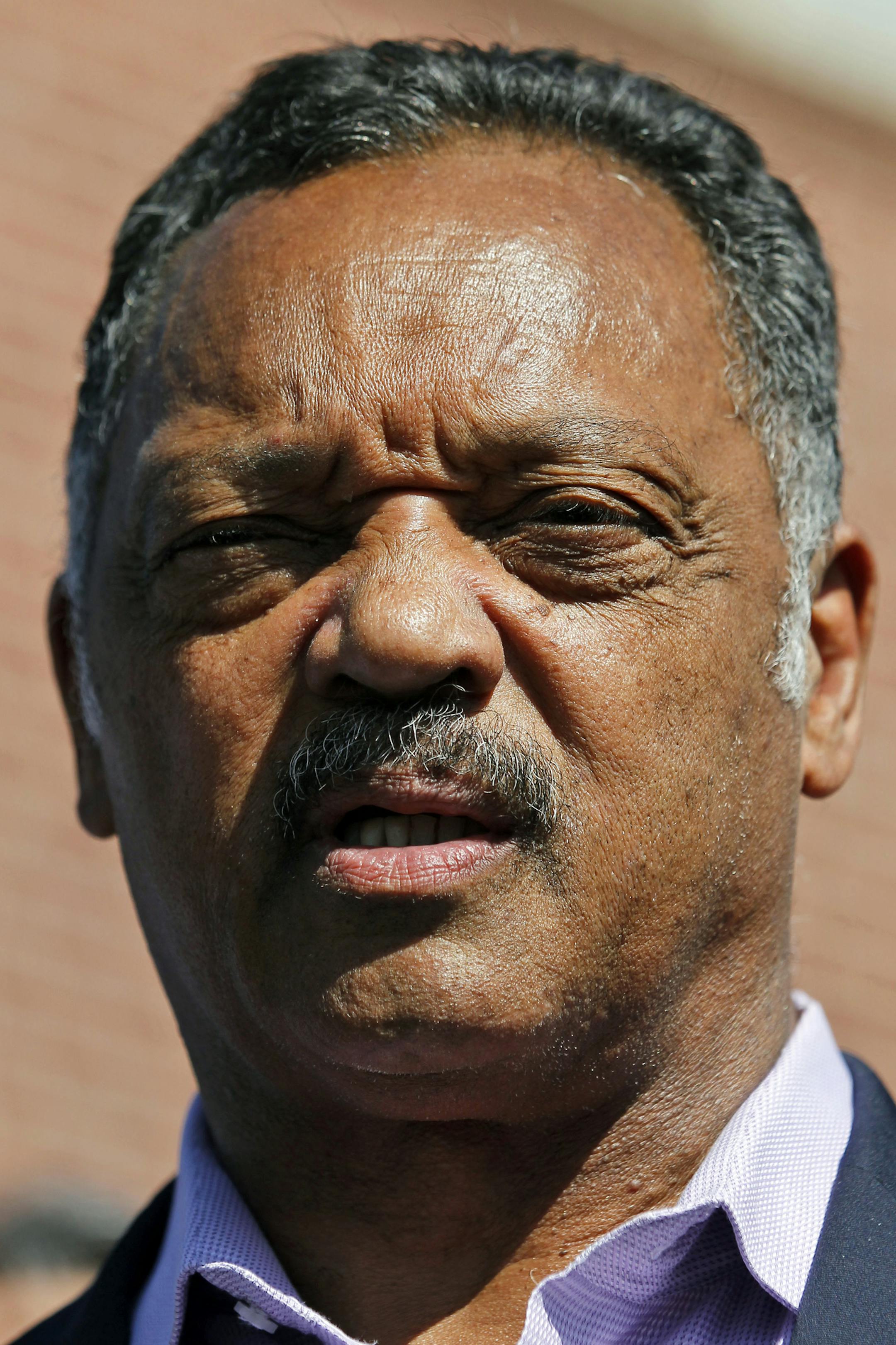 Rev. Jesse Jackson speaks during a media availability near the apartment where accused killer James Homes lived, Thursday, July 26, 2012 in Aurora, Colo. Twelve people were killed and over 50 wounded in a shooting attack early Friday at the packed theater during a showing of the Batman movie, "The Dark Knight Rises." Police have identified the suspected shooter as James Holmes, 24. (AP Photo/Alex Brandon) ORG XMIT: MIN2013021819502883