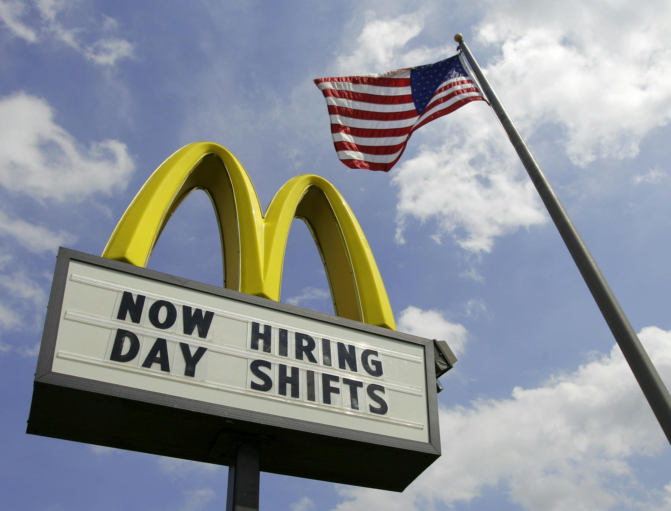 FILE- This May 2, 2012, file photo shows a sign advertising job openings outside a McDonalds restaurant in Chesterland, Ohio. McDonald's said a key sales figure climbed 3.7 percent in August, as the fast-food chain emphasized the value of its menu offerings amid the challenging global economy (AP Photo/Amy Sancetta, File)