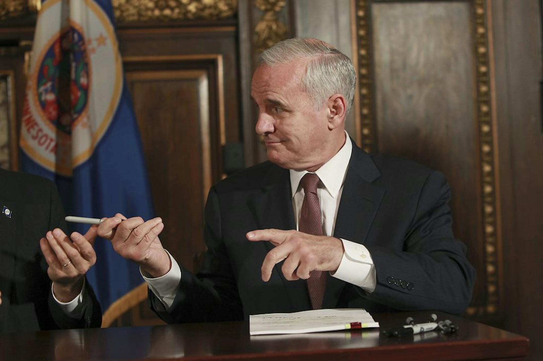 Gov. Mark Dayton on Wednesday signed the bills ending the 19-day state government shutdown.