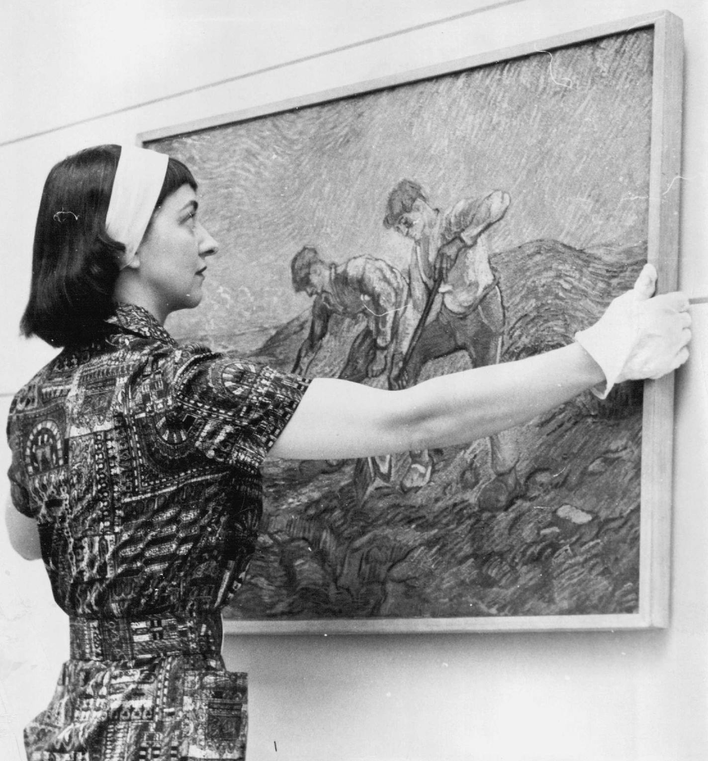 May 03, 1959 Inspection - Clean Register Dorothy Berge of Walker Art center wears white gloves this valuable Van Gogh painting, &#xd2;The Diggers,&#xd3; done in 1889. It is one of five by the famous artist in the &#xd2;Paintings From the Stedelijk Museum&#xd3; show which opens at Walker today. Fifty modern art treasures from the Stedelijk museum in Amsterdam, The Netherlands, valued at more than two million dollars, are included in the show, which closes May 24. Included are works by Matisse, Pi