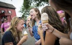 From left, Jayne Mapstone, Jane Sorenson, Mariah Husting and Greta Sorenson enjoyed frozen yogurt outside the dairy building at the Minnesota State Fa