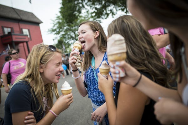 From left, Jayne Mapstone, Jane Sorenson, Mariah Husting and Greta Sorenson enjoyed frozen yogurt outside the dairy building at the Minnesota State Fa