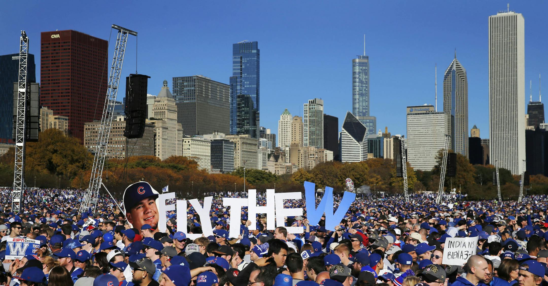 Chicago Cubs fans celebrate during a rally in Grant Park honoring the World Series baseball champions Friday, Nov. 4, 2016, in Chicago. (AP Photo/Charles Rex Arbogast)
