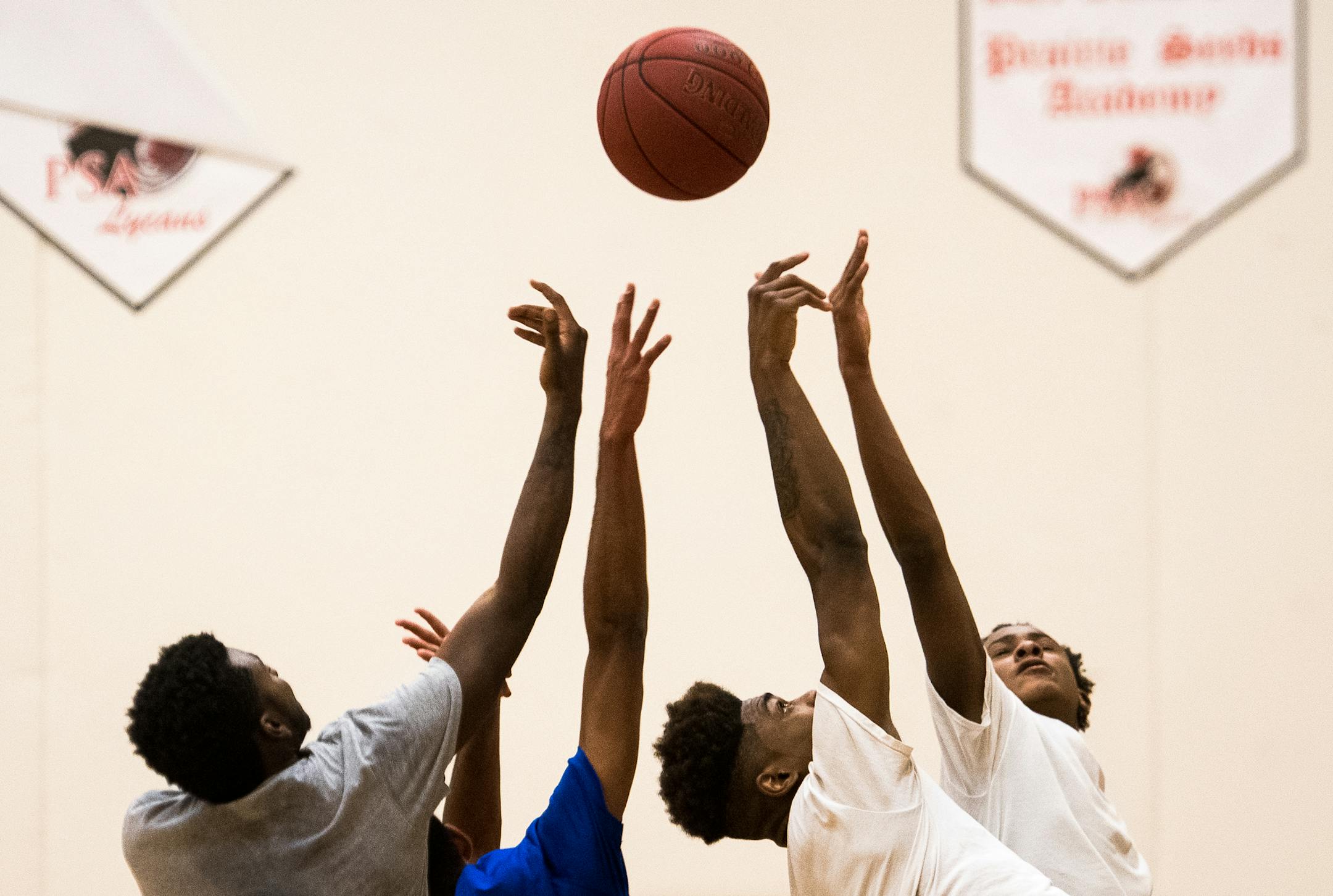 Prairie Seeds Academy players, including senior forward Daveon Gibson, right of center, jumped up for a rebound during Thursday afternoon's practice. ] (AARON LAVINSKY/STAR TRIBUNE) aaron.lavinsky@startribune.com Zone feature on Prairie Seeds Academy photographed Thursday, Dec. 8, 2016 in Brooklyn Park, Minn.