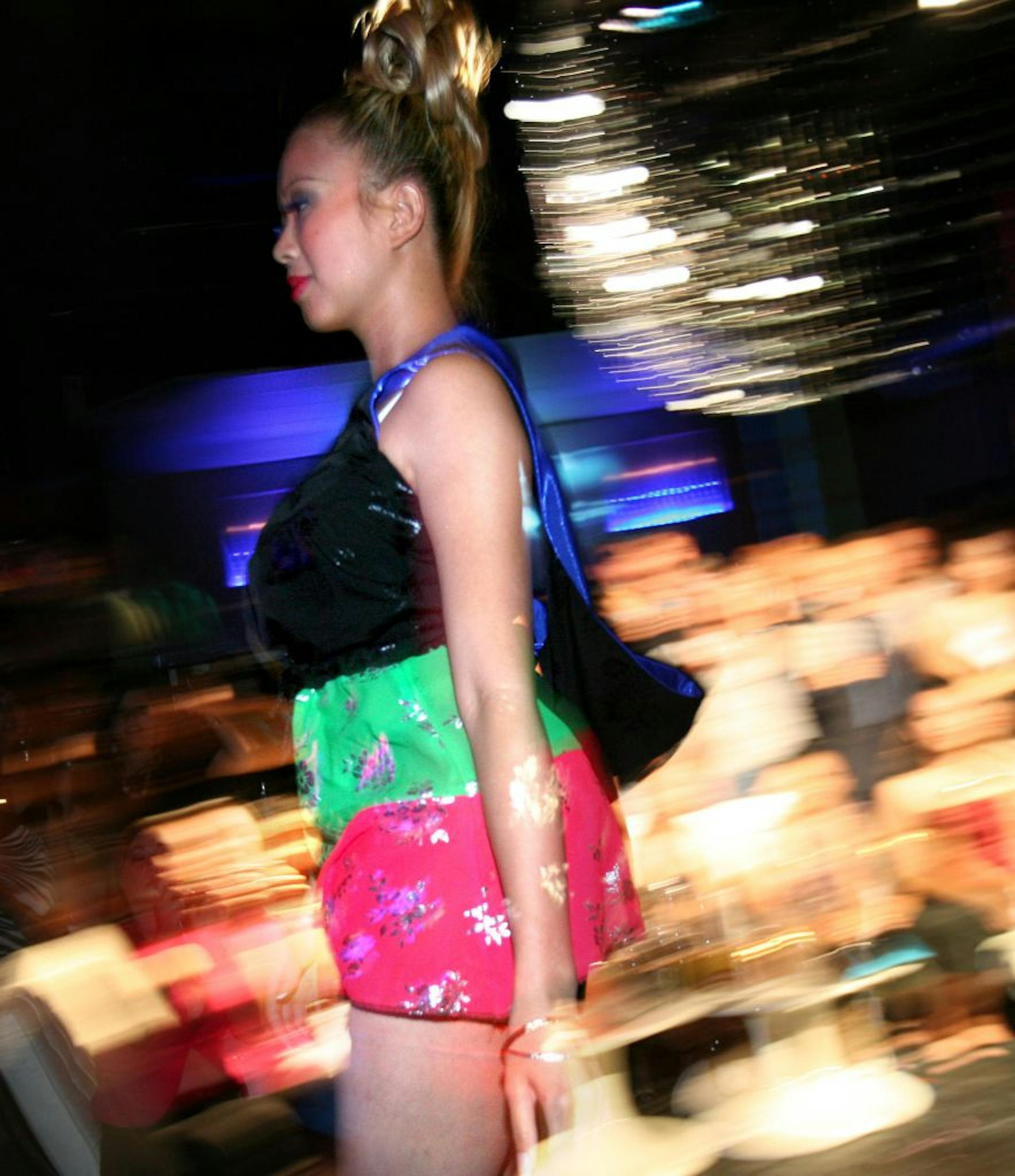 TOM WALLACE � twallace@startribune.com Assign:#111771 SLUG: hmong0724.#111716 Malia, LLC designs hit the runway. ......The Center for Hmong Arts & Talent (or CHAT) held the Fresh Traditions Fashion Show, Last Friday night. The designers, who are members of the local Hmong community, must include aspects of Hmong's traditional dress (certain fabrics, colors, designs) in their contemporary designs. Organzers say incorporating cultural elements into a Western art form is this group's way of tapping