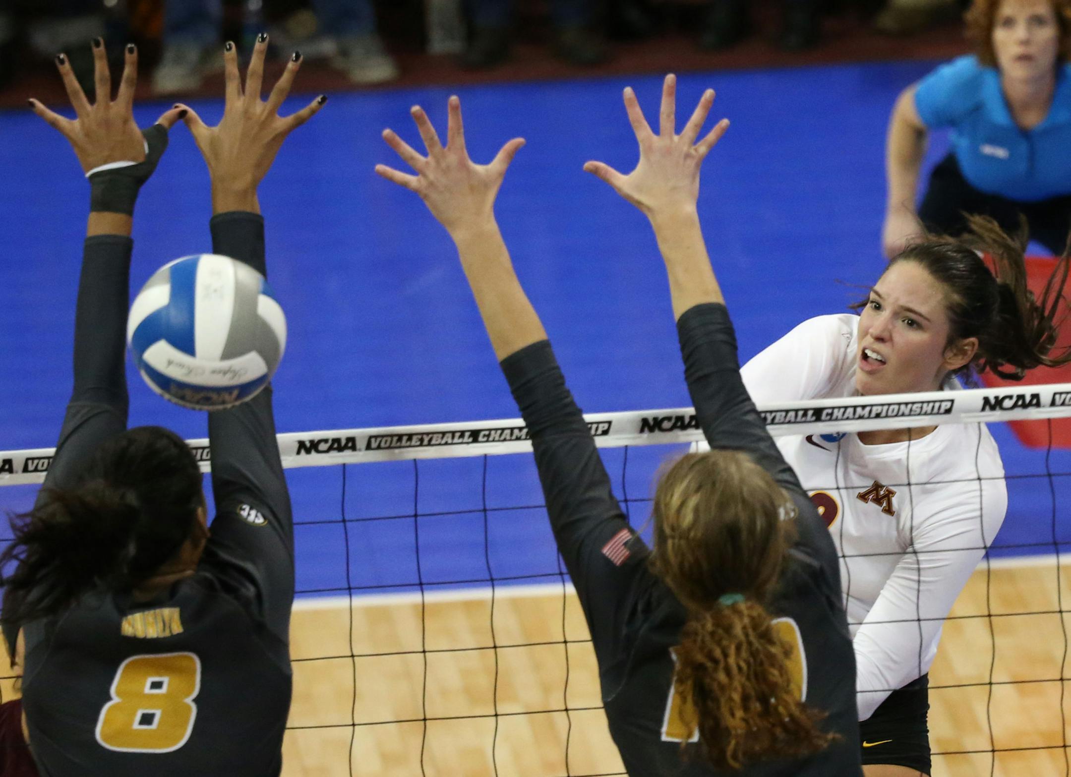 The University of Minnesota's Sarah Wilhite (8) threads the final shot between the University of Missouri's Alyssa Munlyn (8) and Kira Larson (10) giving them a 3 sets to 1 victory over Missouri during the regional NCAA volleyball tournament Friday, Dec. 8, 2016, at the Sports Pavilion in Minneapolis, MN.]
(DAVID JOLES/STARTRIBUNE)djoles@startribune.com The University of Missouri at the University of Minnesota in the regional NCAA volleyball tournament Friday, Dec. 8, 2016, at the Sports Pavilio