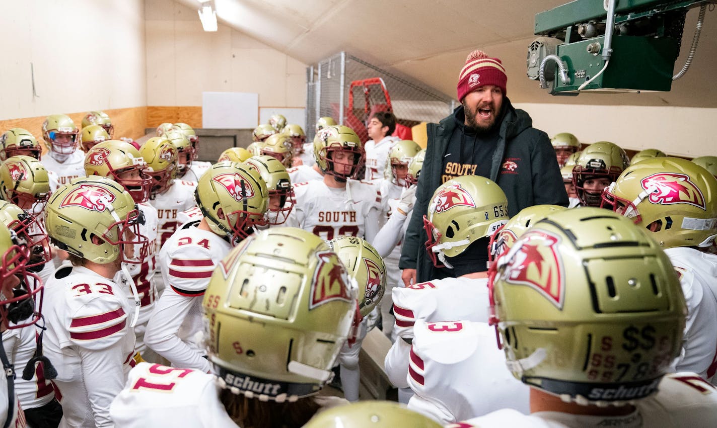 Lakeville South head coach Ben Burk gives a speech to his team before a Class 6A quarterfinal game against Stillwater Friday, Nov. 11, 2022 at Eden Prairie High School in Eden Prairie, Minn. ]