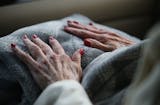 Alice Tolzmann's nails are freshly painted as she rides with her daughter Elizabeth Radichel to watch her grand daughter Christina Radichel in a tennis match Thursday, Sept. 29, 2017, in Golden Valley, MN.
