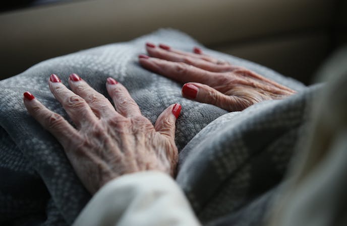 Alice Tolzmann's nails are freshly painted as she rides with her daughter Elizabeth Radichel to watch her grand daughter Christina Radichel in a tennis match Thursday, Sept. 29, 2017, in Golden Valley, MN.