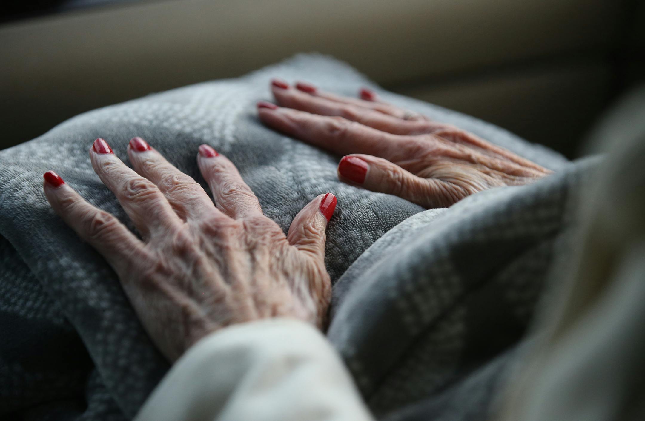 Alice Tolzmann's nails are freshly painted as she rides with her daughter Elizabeth Radichel to watch her grand daughter Christina Radichel in a tennis match Thursday, Sept. 29, 2017, in Golden Valley, MN.